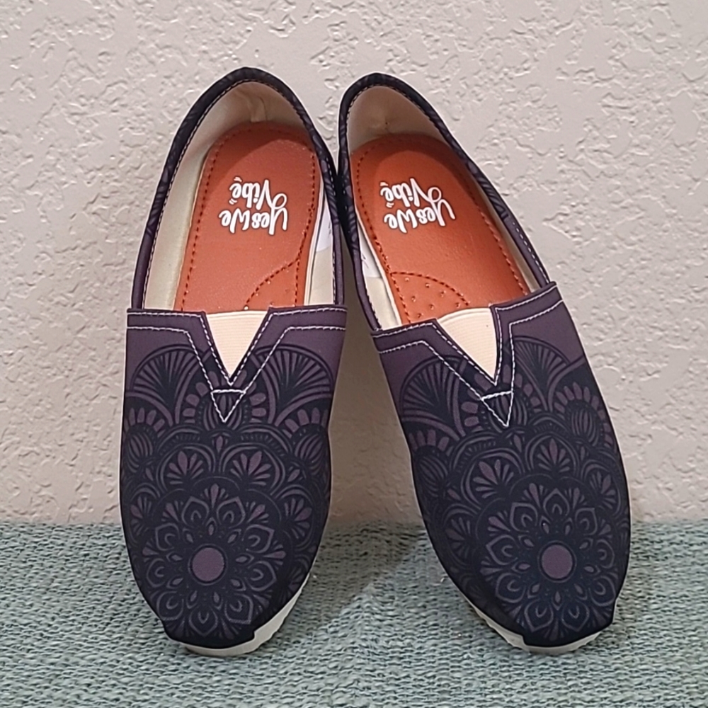 Never worn "Yes We Vibe" slip on shoes. Size US 8.5. Charcoal and black color.